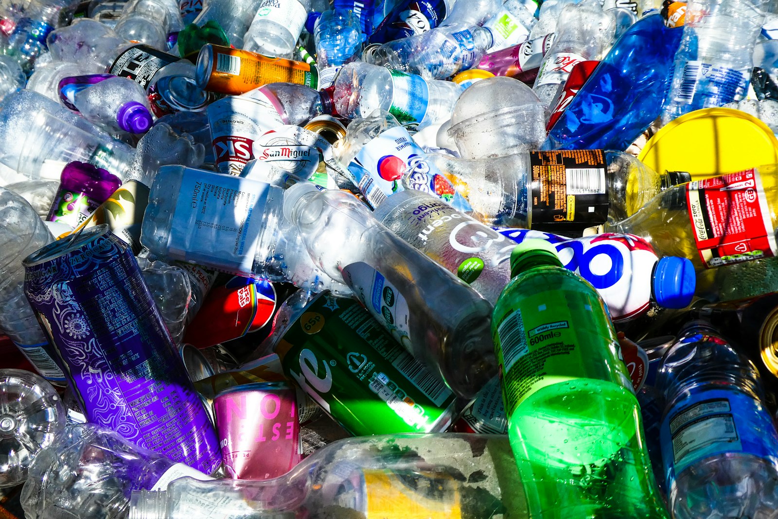 Pile of empty plastic bottles and aluminium cans ready for recycling